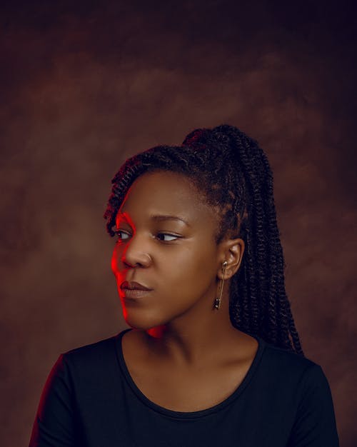 Woman with Braided Hair Looking Sideways