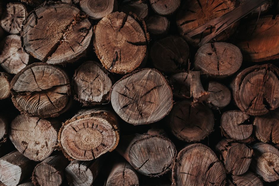 Close-up of stacked firewood showcasing natural textures and patterns.