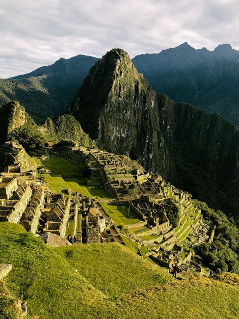 A stunning aerial shot of the ancient Incan city of Machu Picchu in Peru, showcasing its historical ruins.