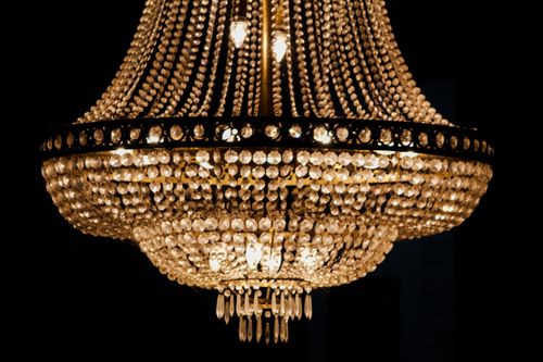 Free Elegant crystal chandelier with a dark background, evoking luxury and sophistication. Stock Photo
