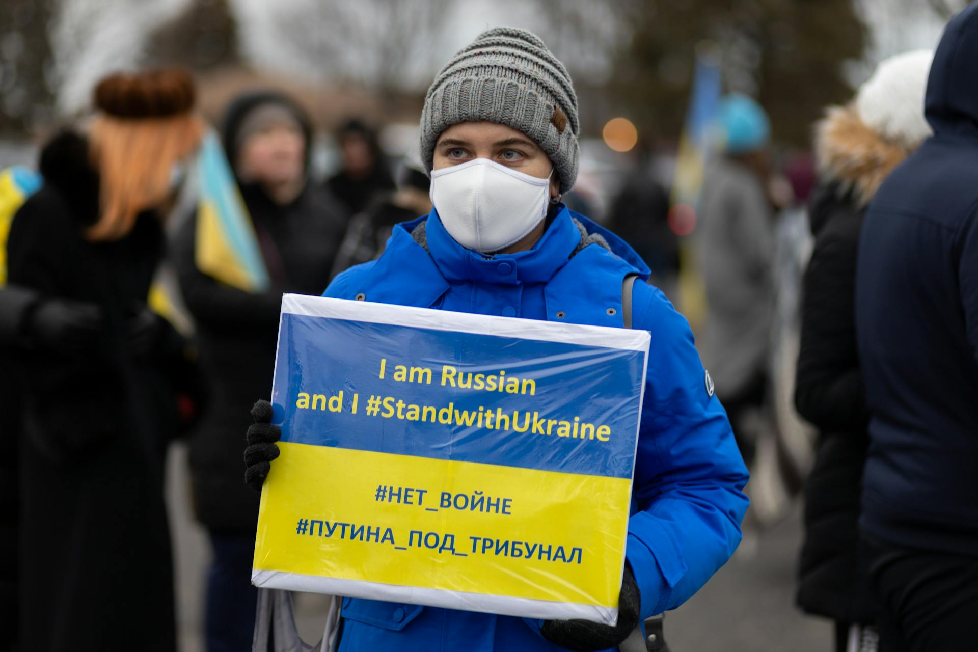 Russian with a Banner Expressing Support for Ukraine on Demonstration