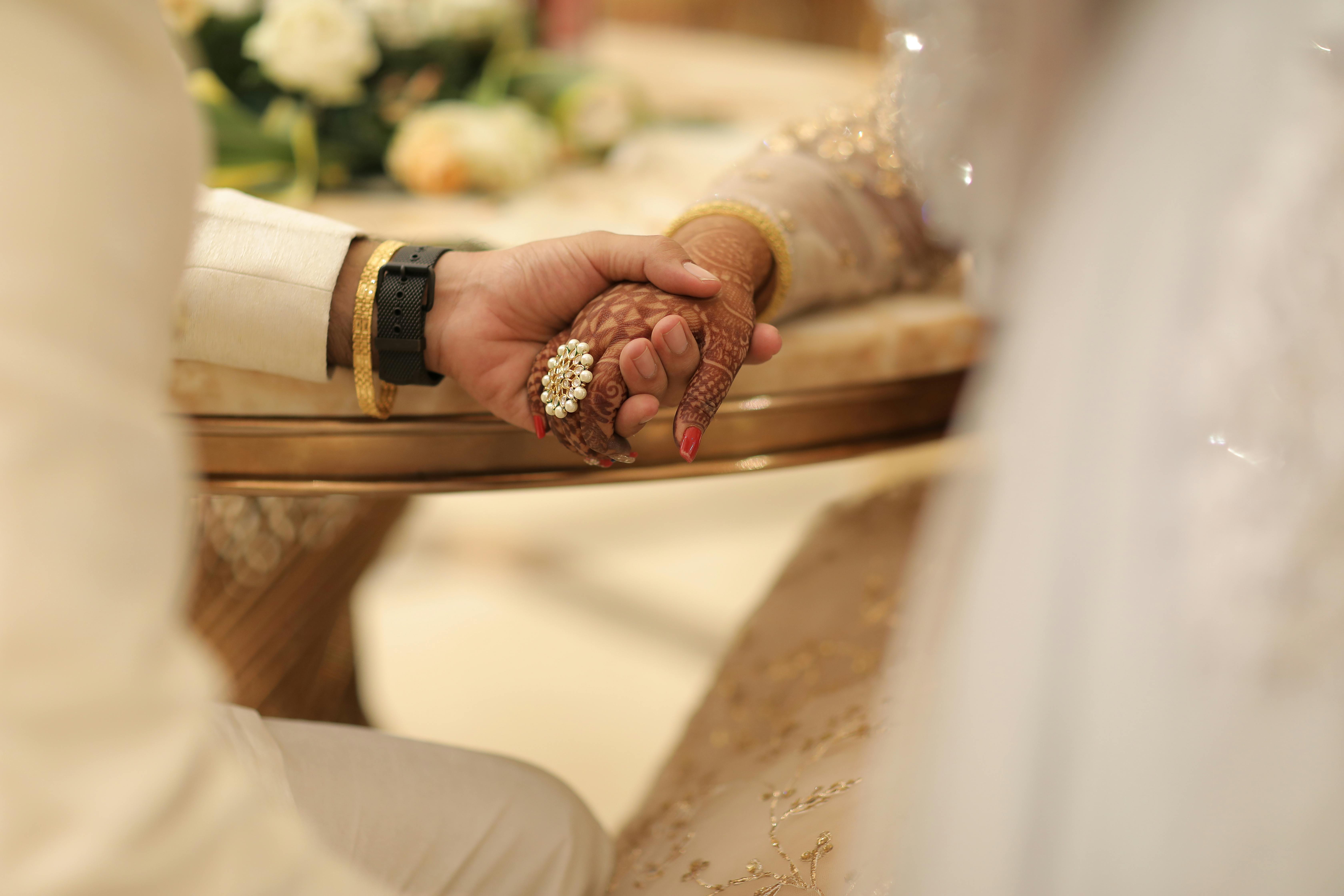 real bride and groom holding hands