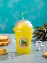 Yellow and White Plastic Cup With Green Straw