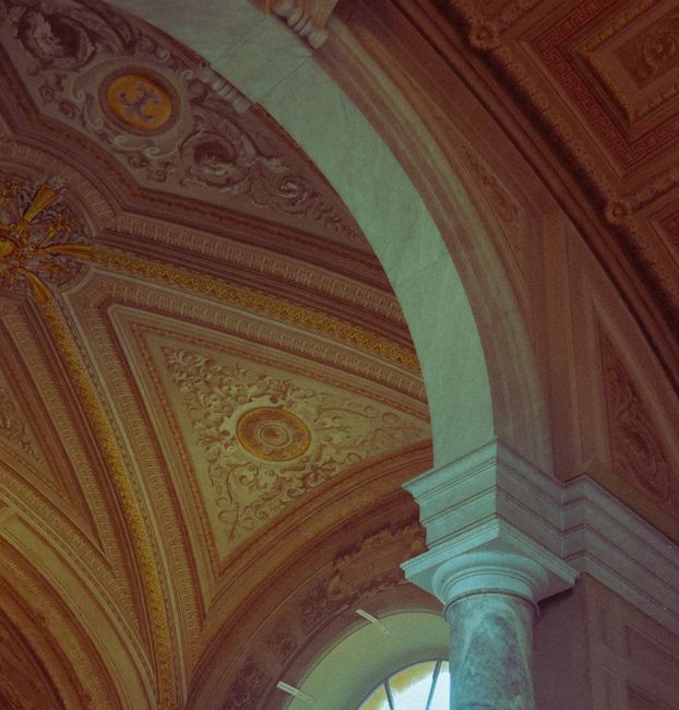 Detailed view of Vatican's ornate ceiling showcasing classical Roman architecture.