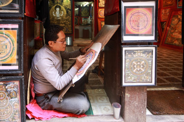 Man Painting On Canvas