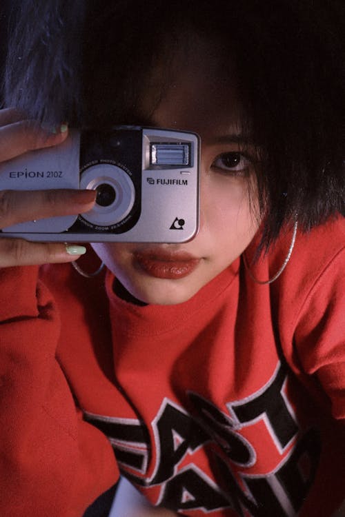 Young Woman with Analog Camera
