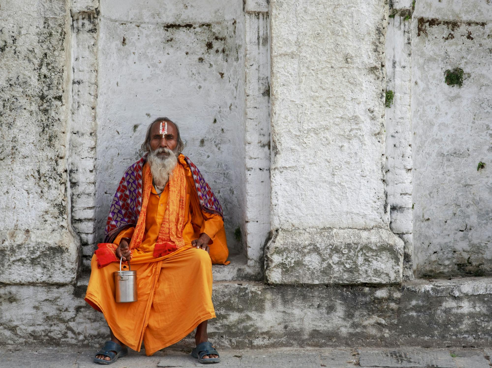 Hindu Priest Photo by Mehmet Turgut  Kirkgoz  from Pexels: https://www.pexels.com/photo/indian-man-in-traditional-indian-clothes-sitting-on-a-concrete-11486450/