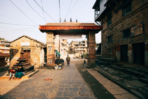 Free A serene street scene in Nepal featuring traditional architecture and cultural elements. Stock Photo