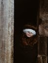 Blindfolded Teenage Girl in Ajar Door 