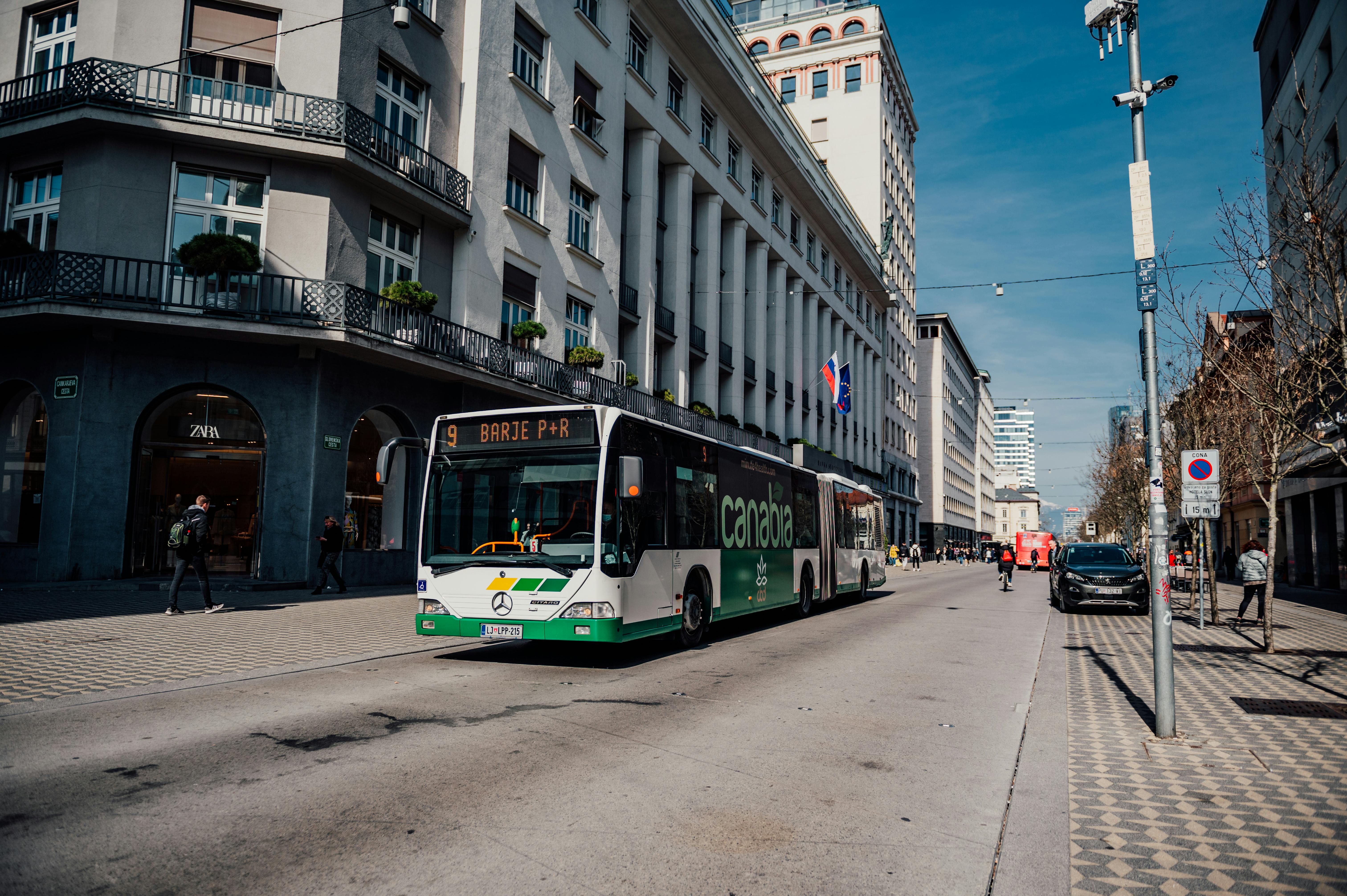 Free City bus on a street in Ljubljana, Slovenia, showcasing urban life and public transportation. Stock Photo