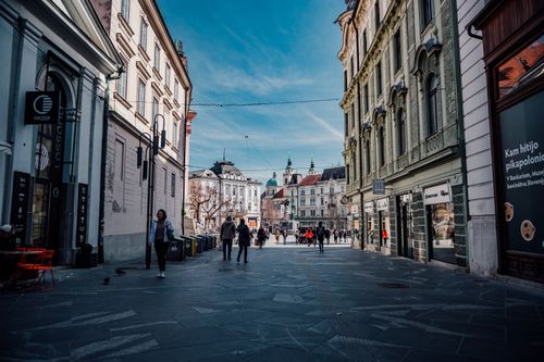 Free Urban street scene in Ljubljana, Slovenia with historic buildings and pedestrians. Stock Photo