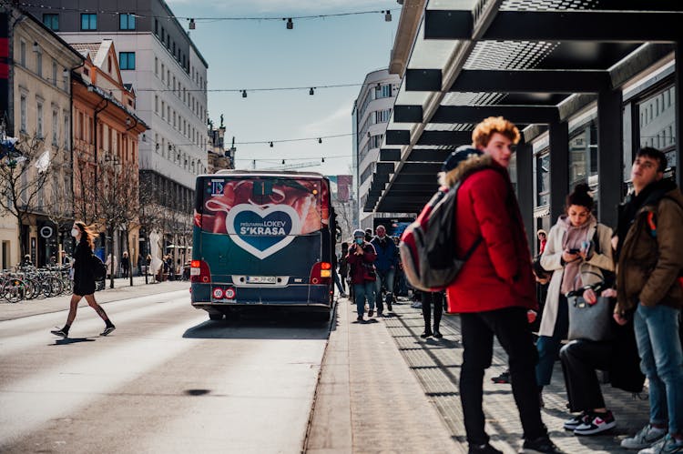 People Standing On Bus Stop