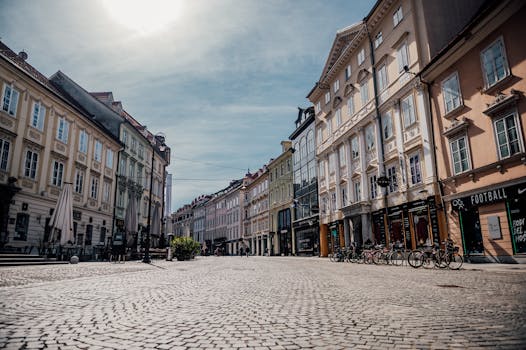 Beautiful historic street in Ljubljana, Slovenia with cobblestone pavement and classic architecture.