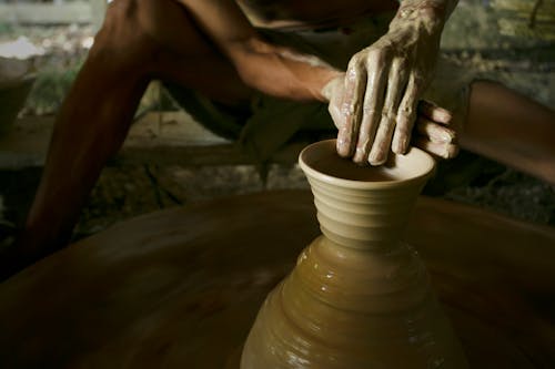 Free A Person Molding a Clay Stock Photo