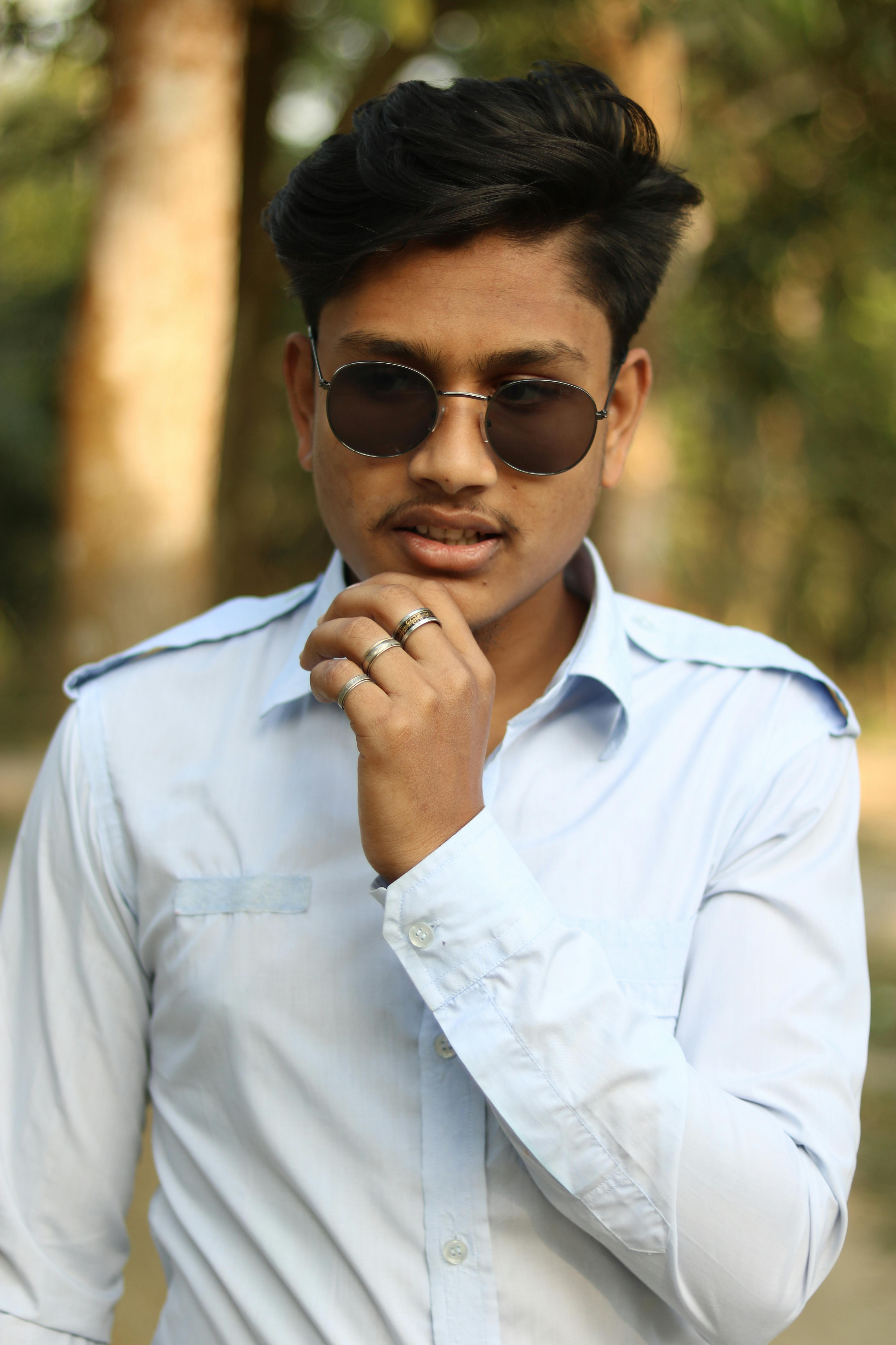 man in white dress shirt wearing sunglasses