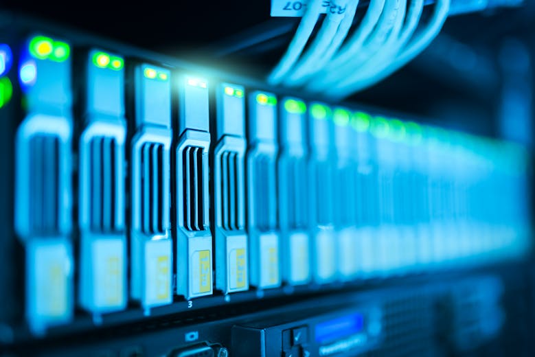 Server racks indicating software deployment to a production environment