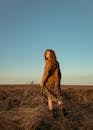 Back View of Redhead Girl Standing in Fields