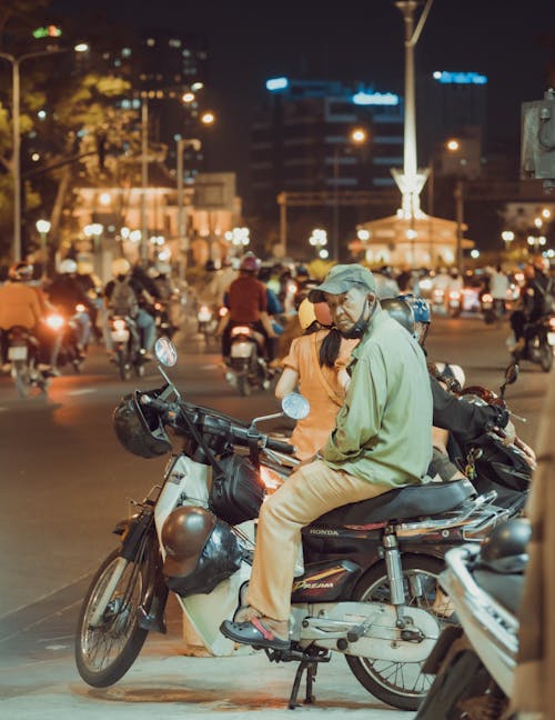 Free Man in Green Long Sleeve Shirt Sitting on Black Motorcycle Stock Photo