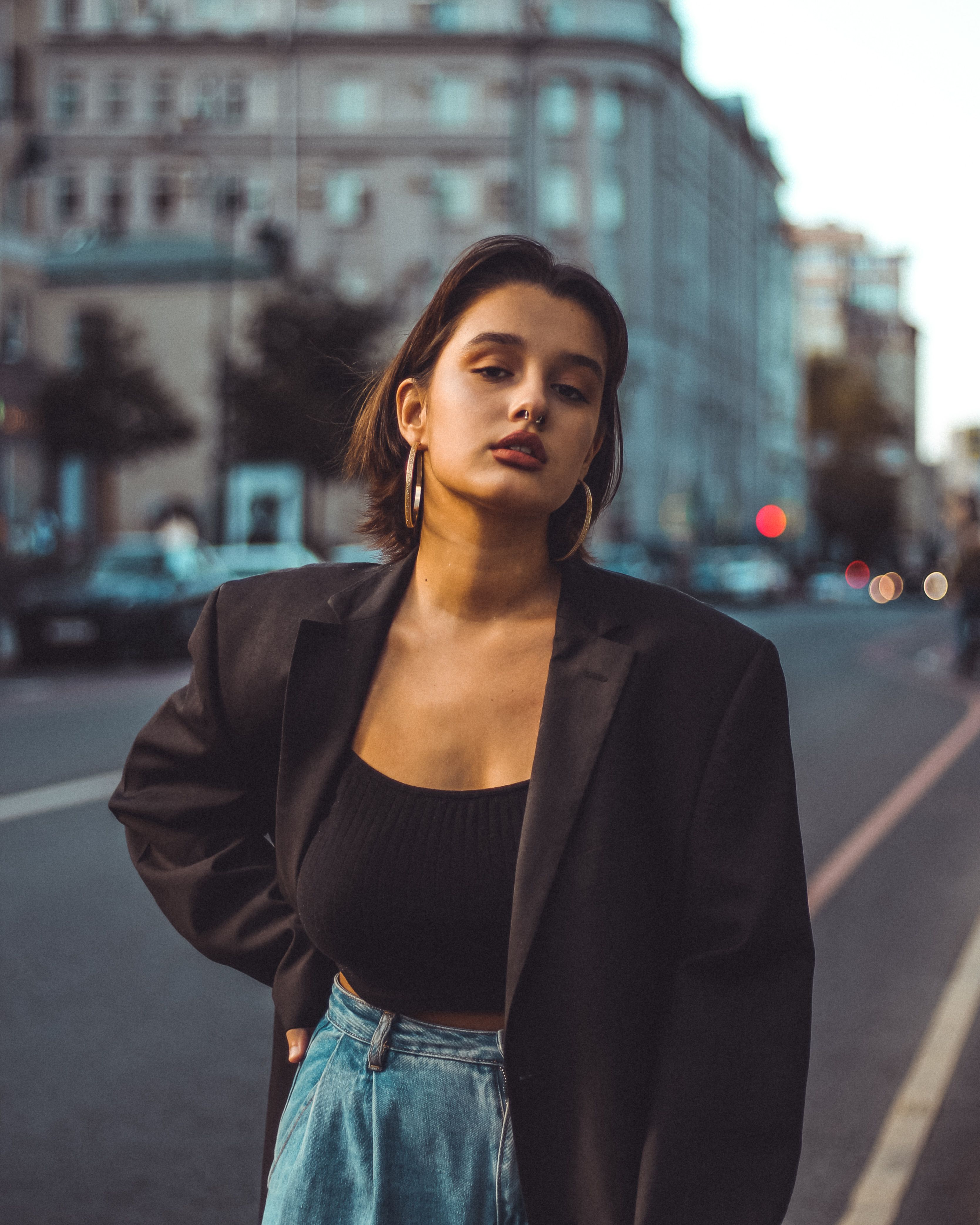 A Woman in Black Blazer and Blue Denim Jeans · Free Stock Photo