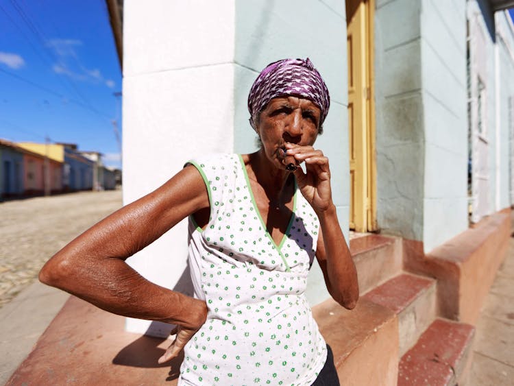 Elderly Woman Smoking On Street