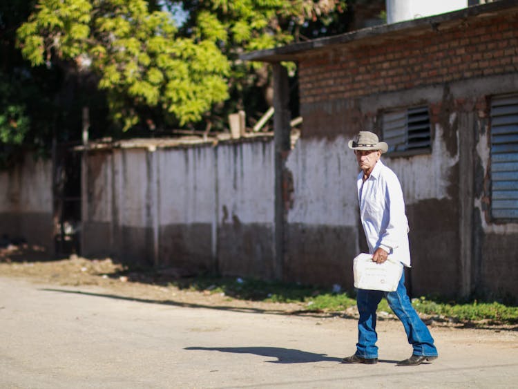 Man Walking On A Road 