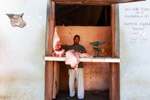 A Man Cutting Meat