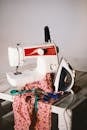 White Sewing Machine, Clothes Iron, and Scissors