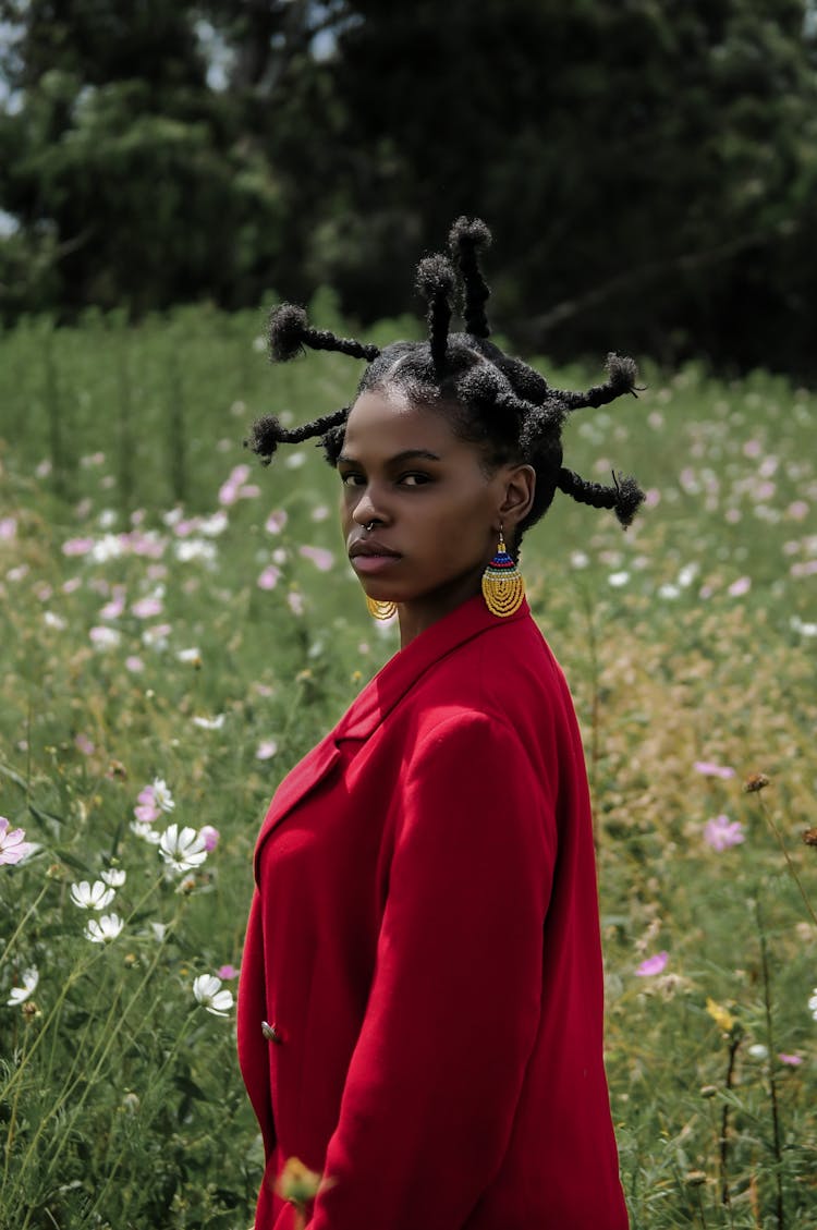 Woman With Sticking Out Pigtails And Red Coat