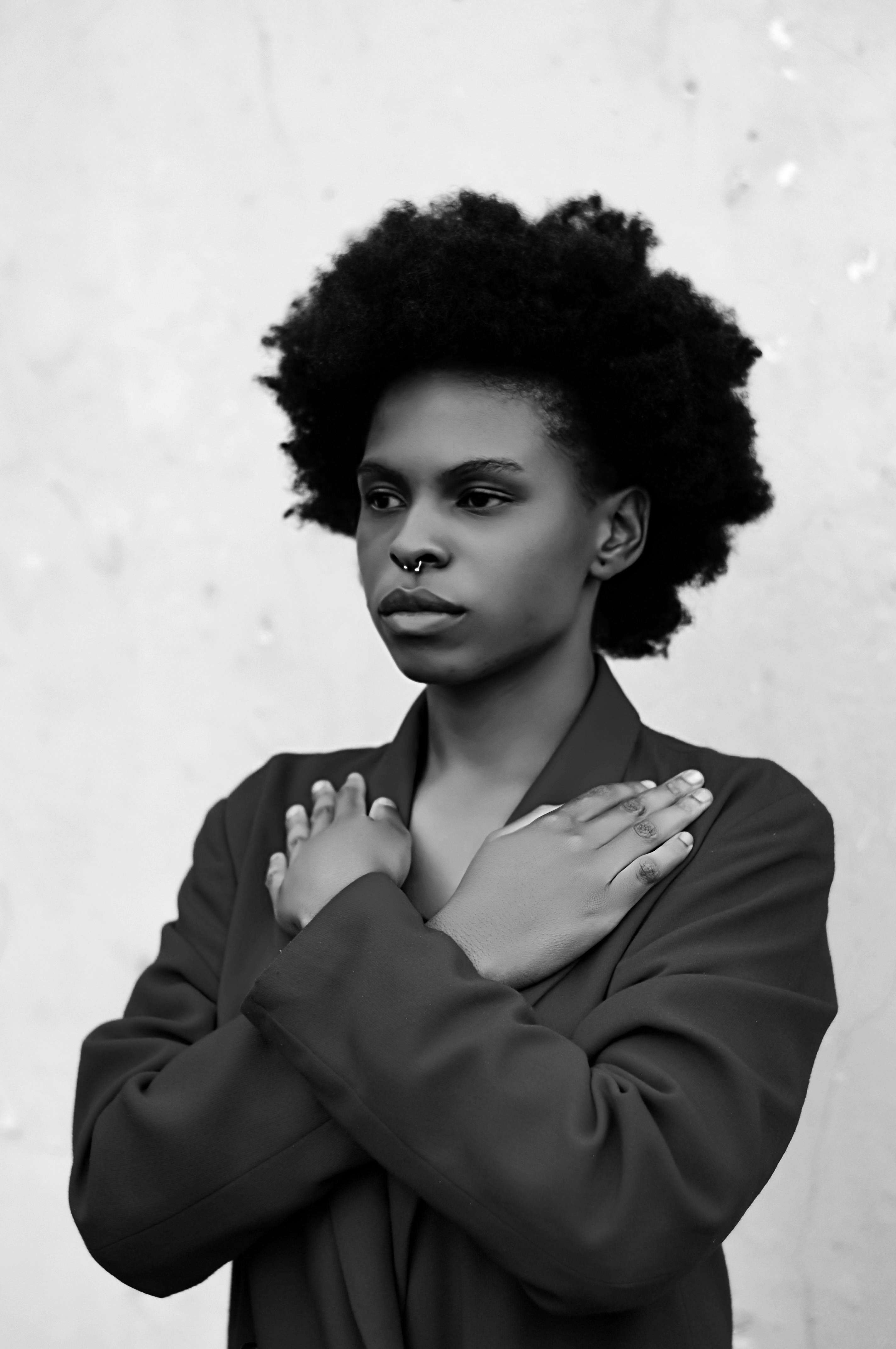 Grayscale Photo of Woman with Afro Hair Posing · Free Stock Photo