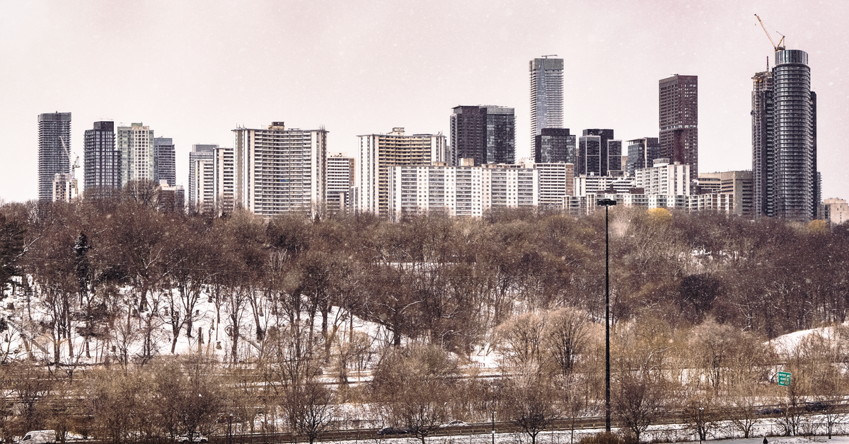 Downtown Toronto condo towers at dusk illustrating peak-to-present condo prices in the city market