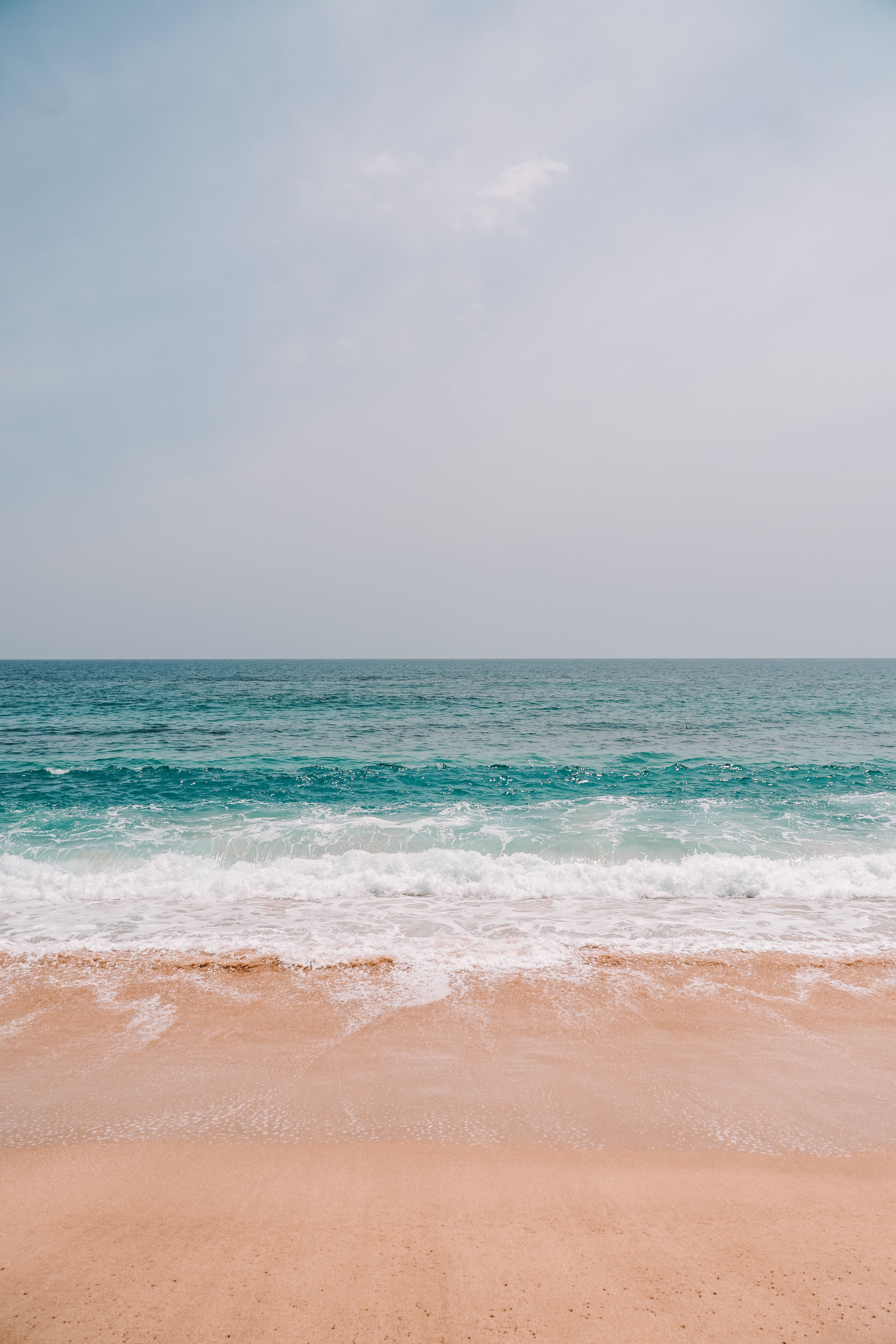 Aerial View of Crashing Waves on the Shore · Free Stock Photo
