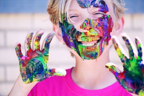 Free Boy in Pink Crew-neck Top With Paints on His Hands and Face Stock Photo