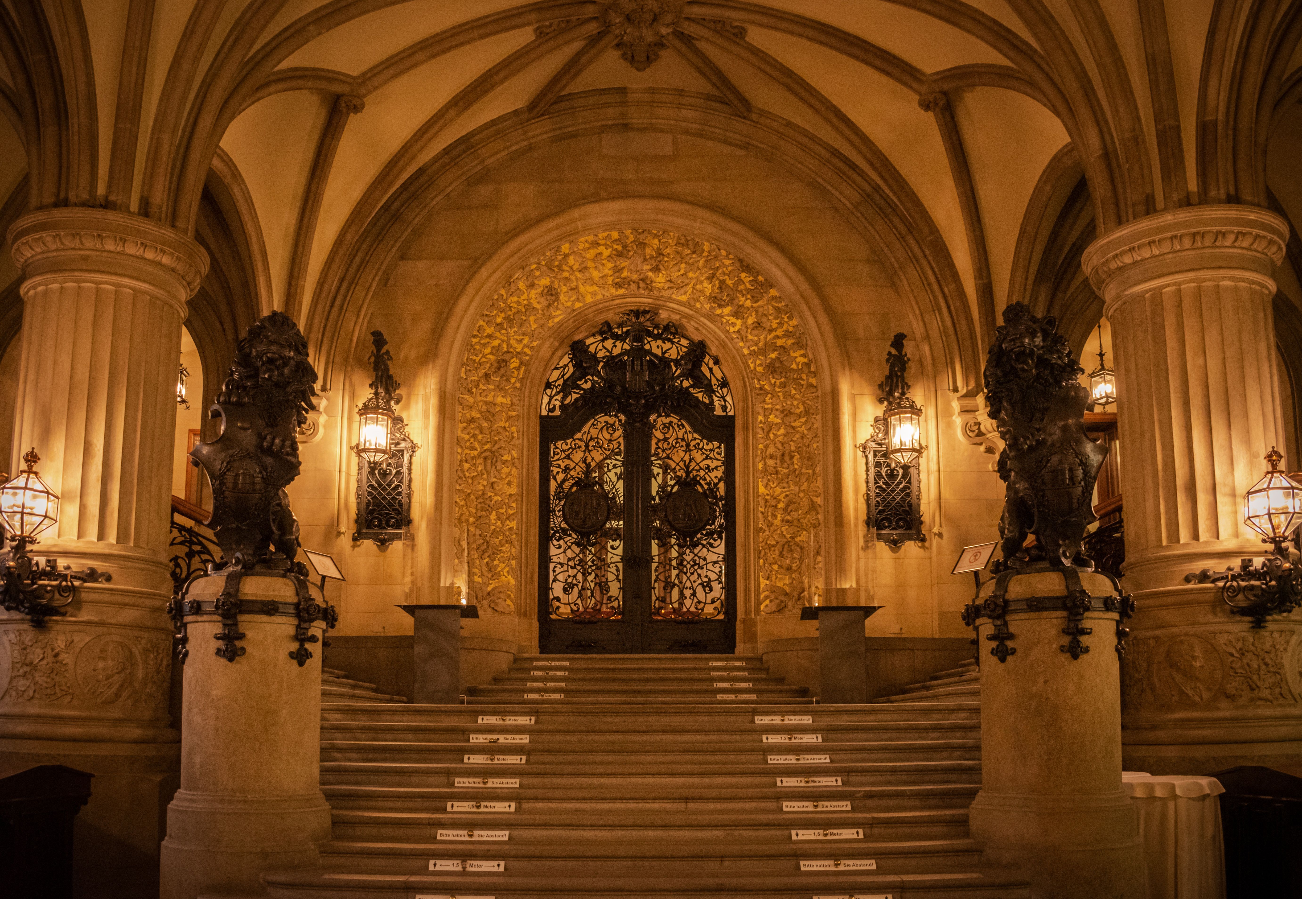 Ornate architectural details of the Hamburg City Hall interior, showcasing classic design.
