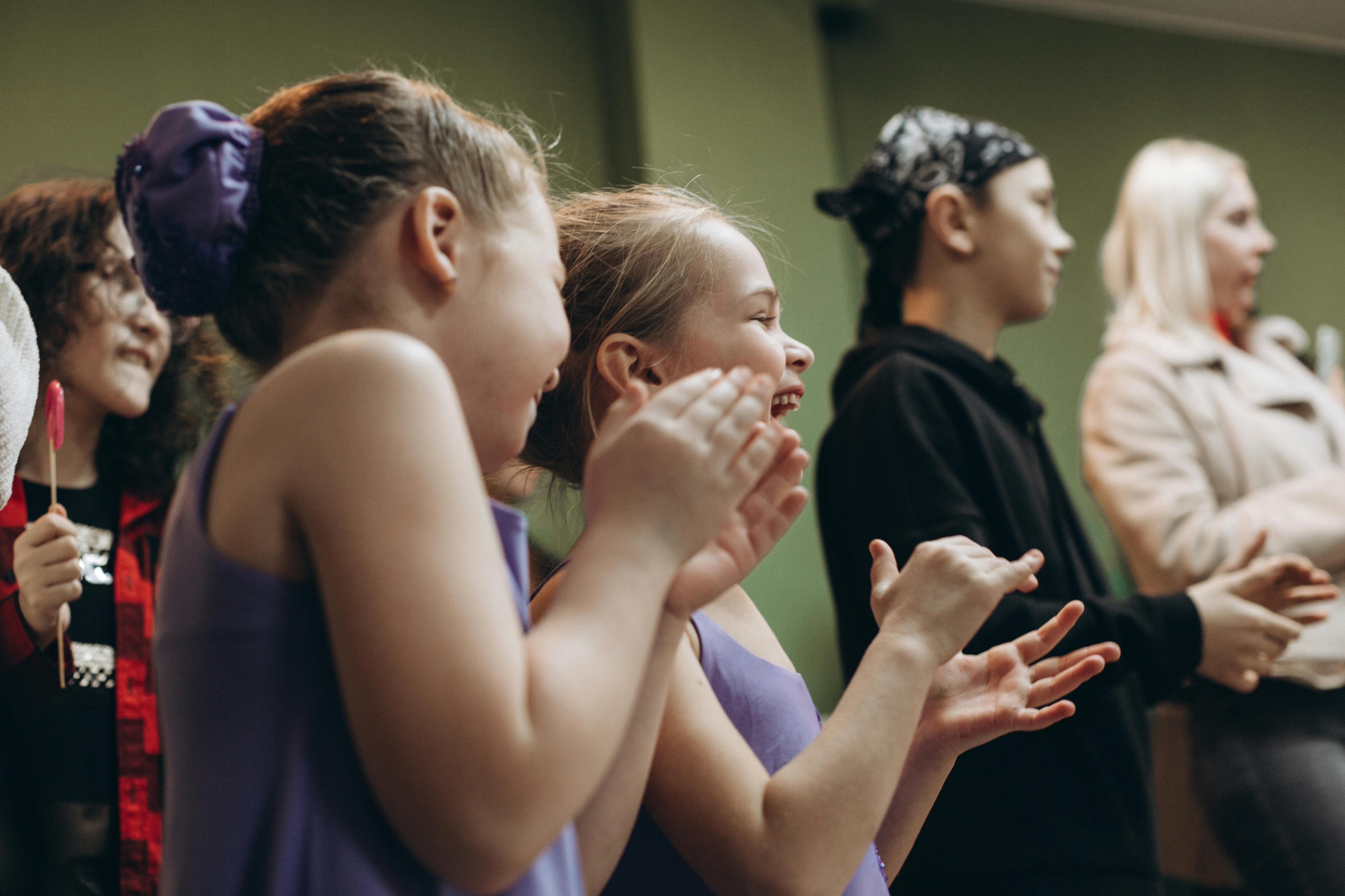 laughing girls clapping