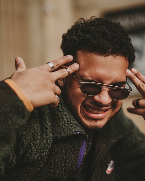 Close Up Photo of Man Wearing Sunglasses