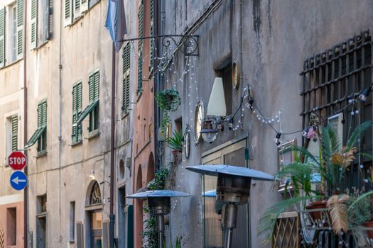 Picturesque Italian street showcasing historic buildings and vibrant decor.