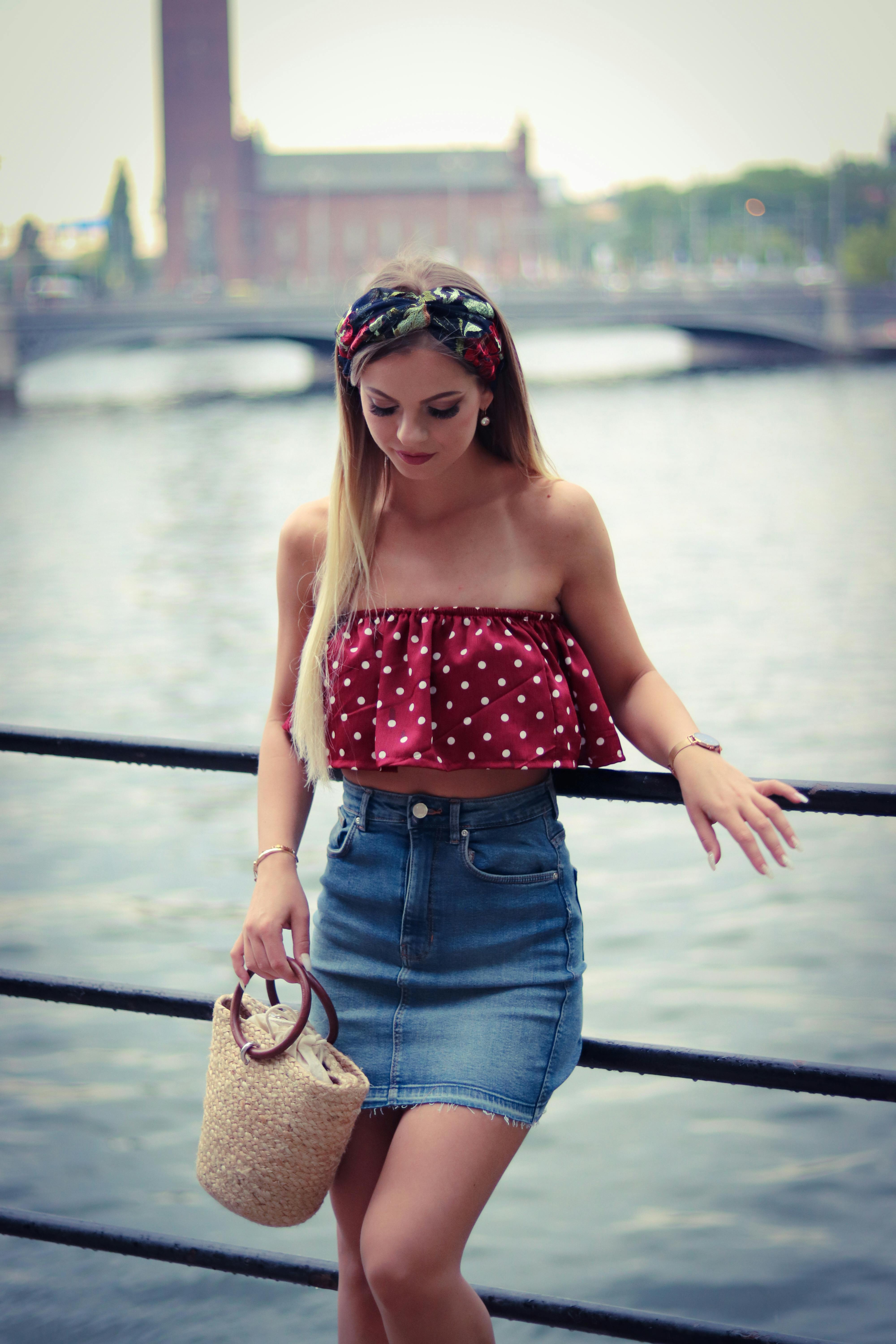 Woman Wearing Red And White Crop Top Beside The Body Of Water Free Stock Photo