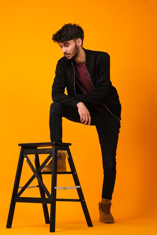 A Man in Black Jacket and Black Pants 