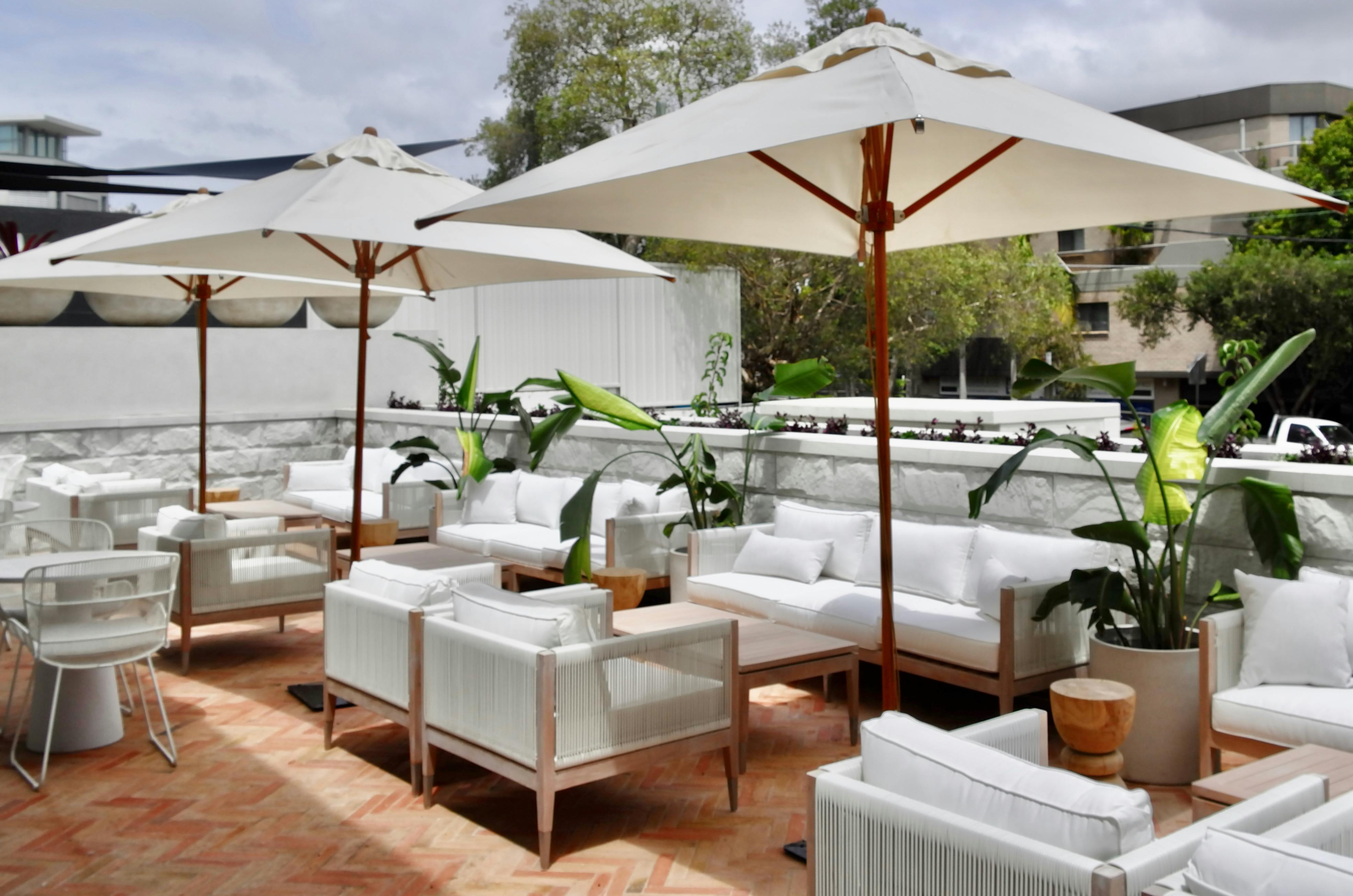 Rooftop Garden with Seating and Umbrellas - Rooftop access apartments
