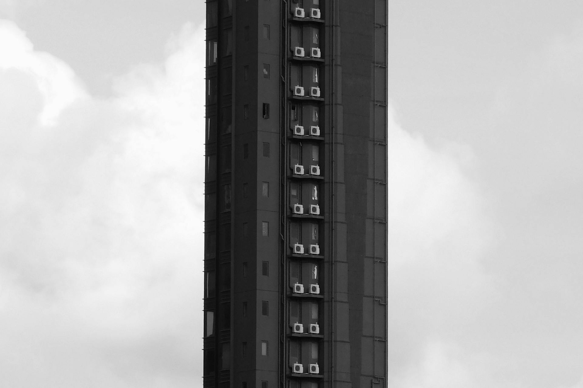 Rows of Air Conditioners on a Tall Skyscraper
