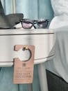 Black Framed Sunglasses on White Plastic Container