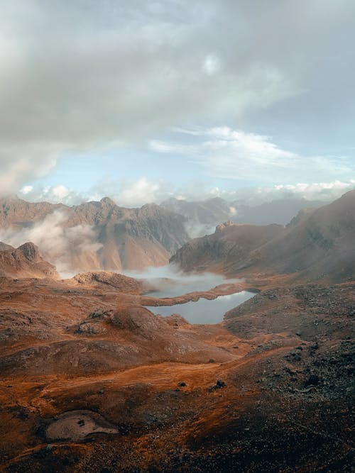 Brown Mountains Under White Clouds