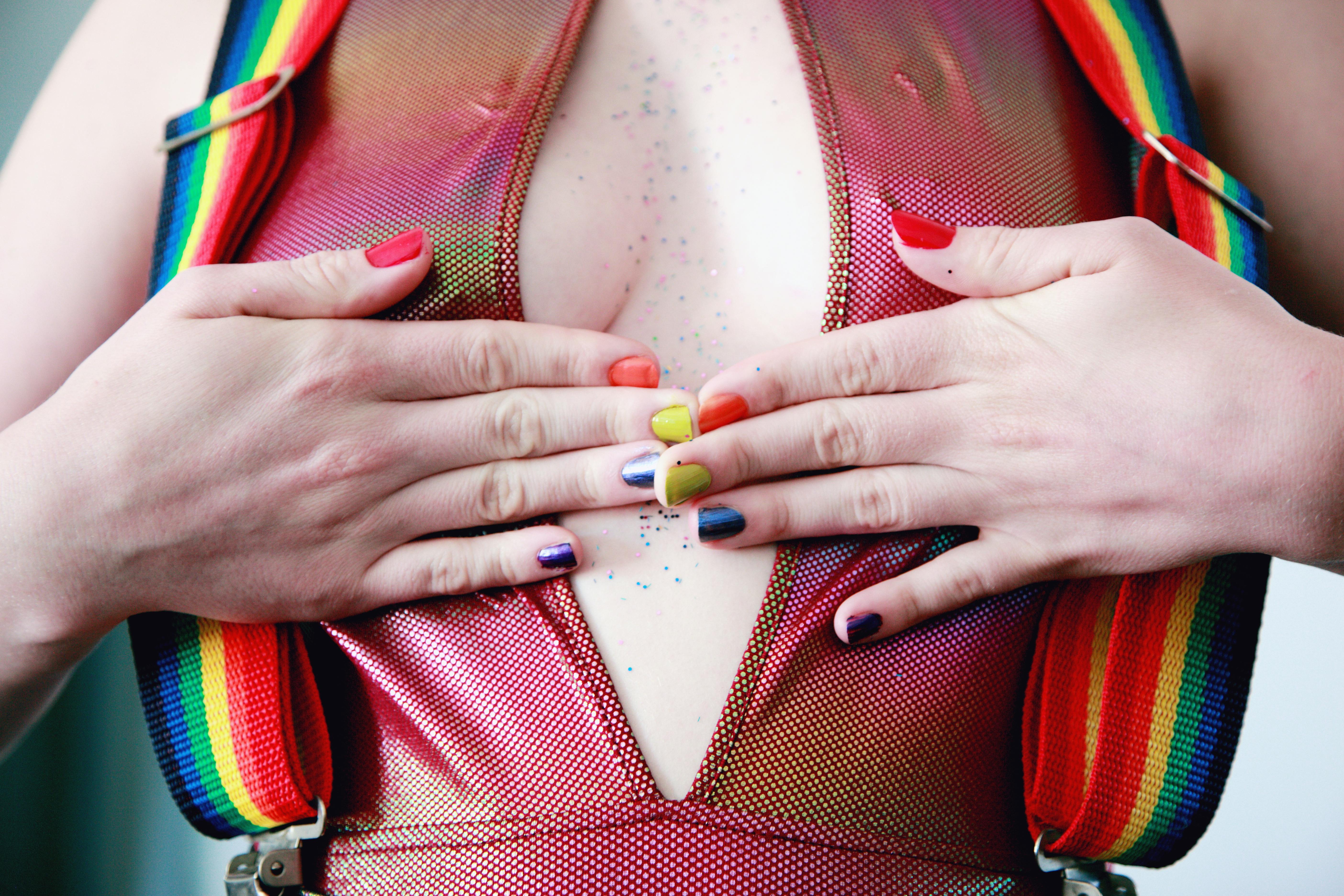 woman with multicolored nail polishes