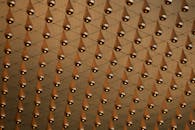 Rows of Metallic Droplets Hanging from the Ceiling