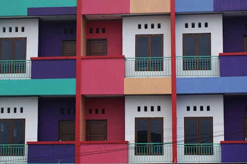 Colorful Building Facade with Balconies and Windows
