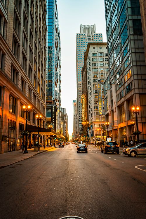 Free Vibrant urban street scene in downtown Chicago with towering skyscrapers at dusk. Stock Photo