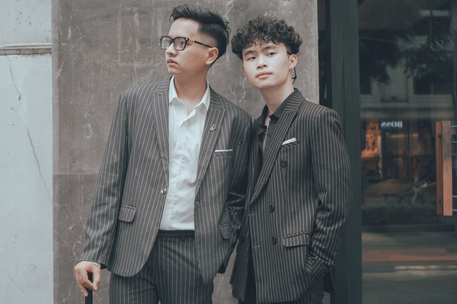 Men in stripe suits standing outdoors