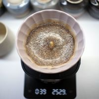 Coffee brewing in a ceramic pour-over dripper — photo by Fuadi Afif on Pexels