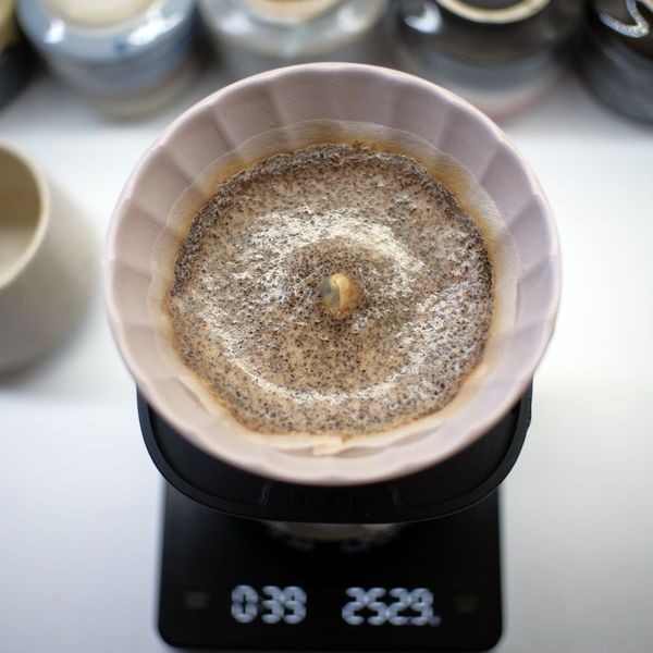 Coffee brewing through a ceramic pour-over cone, photo by Fuadi Afif on Pexels