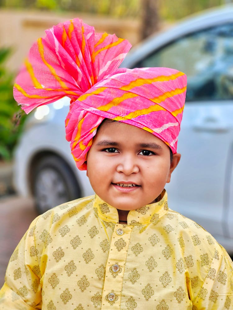 A Boy Wearing Pink And Yellow Pagri